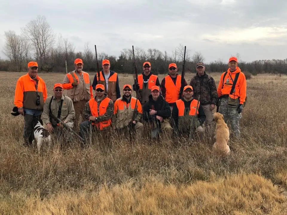 Image of a group of hunters in a field
